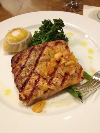 Grilled salmon, tomato chutney, and broccolini in the Bellagio. 