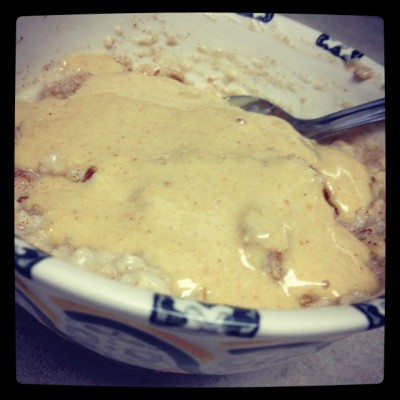 Protein Oats topped with a thick mixture of PB2 and protein powder, making frosting! 