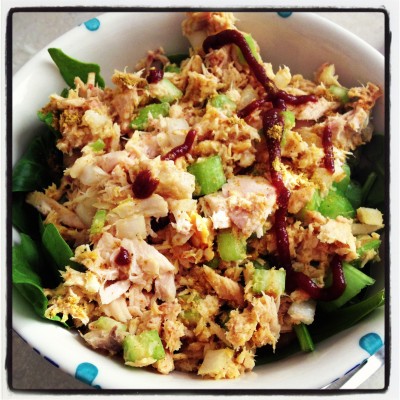 Curried tuna salad on a bed of spinach. 